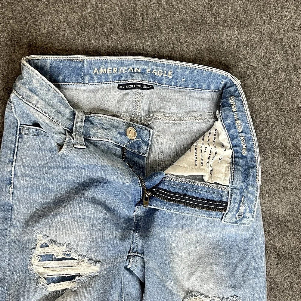 American Eagle Destroyed Next Level Stretch Hi Rise Jegging Sz 0 Short‎ Light